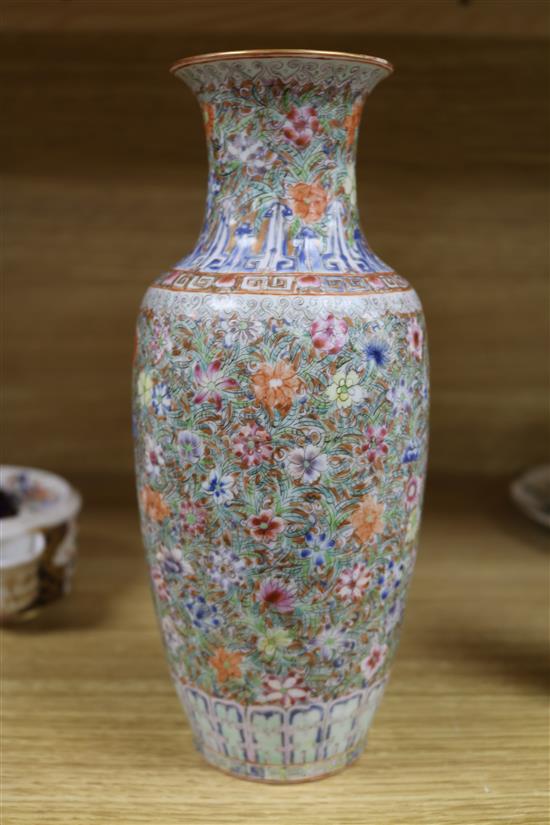 A Chinese famille rose small millefleur vase, Republic period, bearing a Qianlong mark height 23cm